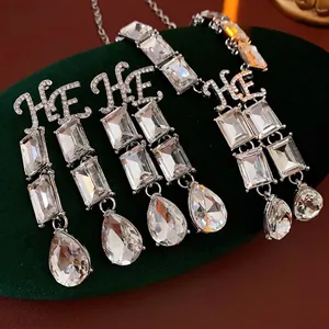 Luxury silver square water drop crystal jewelry set with HE letter design on velvet