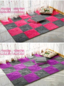 Detail view of plush EVA foam puzzle floor mats in grey, rose, and purple combinations