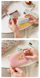 Macro detail of macaron-colored PU leather coin purse with heart zipper and D-ring hook