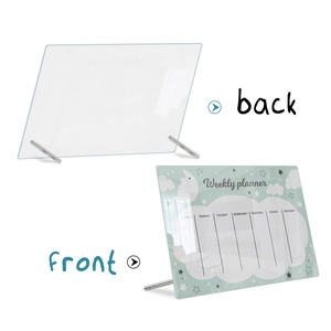 Front and back macro view of a clear acrylic weekly planner with cloud and star patterns