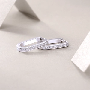 Detailed side view of silver rectangular hoop earrings featuring double row pavé moissanite