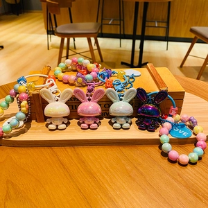 Plated acrylic rabbit keychains with colorful alphabet beads and floral charms