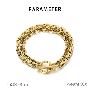 Detail view of gold double-layer cuban link bracelet with T-bar clasp and size specs