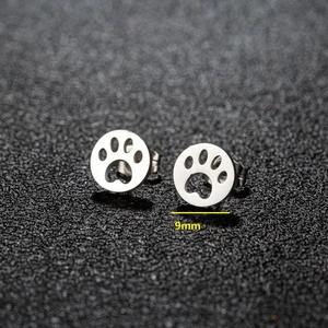 Pair of minimalist 9mm silver stainless steel round stud earrings with paw print cutouts