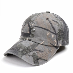 Detail of camouflage baseball cap showing heavy-duty fabric and embroidered eyelets