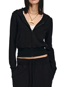Detail of a slim fit black zip-up hoodie featuring thumbhole sleeves and soft cotton fabric
