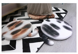 Detailed view of round cat cushion with 3D tail and realistic animal fur texture