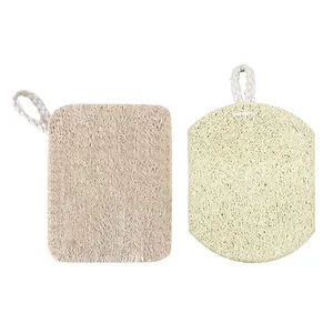 Close-up of natural loofah dish sponges in two shapes with cotton hanging ropes