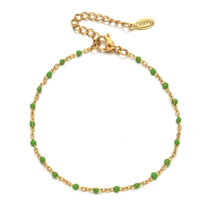 Close-up of gold-plated stainless steel bracelet with green beads and S.steel hallmark