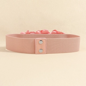 Pink elastic waist belt featuring a decorative 3D rose flower and metal snap button closure