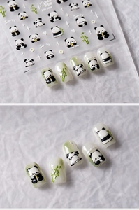 Detail of panda and bamboo nail art stickers on clear backing with decorated nail tips