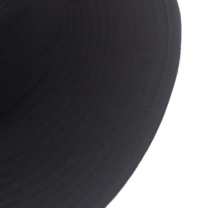Detailed view of black wide-brim sun hat featuring reinforced multi-row stitching design
