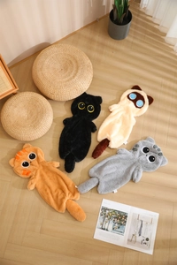 Detail of four colorful plush cat-shaped pillow covers in soft long-pile faux fur