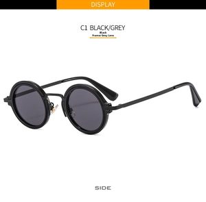 Detail view of round punk sunglasses in C1 black frame and grey lenses with metal hinge