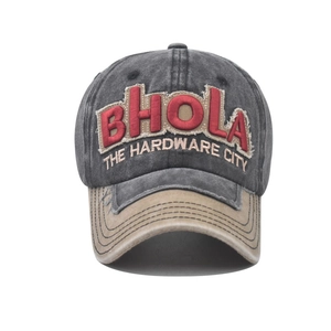 Close-up of 3D embroidery BHOLA text on vintage washed canvas baseball cap with khaki brim