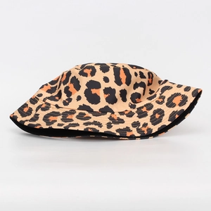Leopard print bucket hat with black and orange spots on khaki base in front view