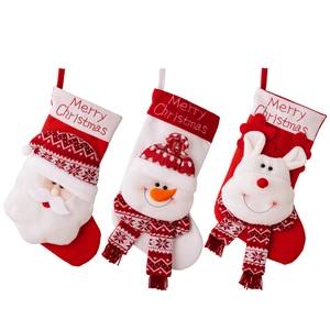 3-pack knitted Christmas stockings with 3D Santa, Snowman, and Reindeer figurines
