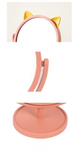 Detail view of pink cat ear makeup mirror showing its stable base and 360 rotation feature