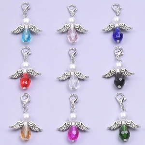 Detailed grid of nine crystal angel wing pendants with alloy hooks in vibrant colors