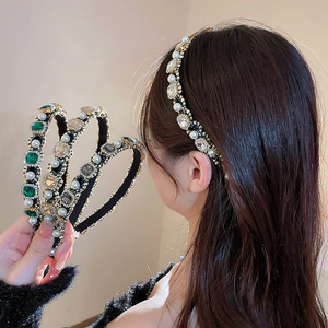 Detail of slim headband featuring pearls and rhinestones in various colors