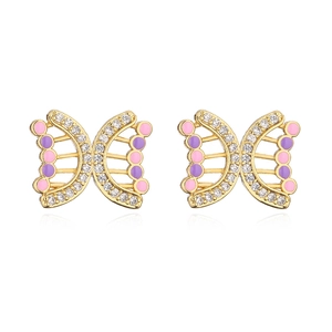 Macro detail of 18K gold plated butterfly earrings with colorful enamel and cubic zirconia