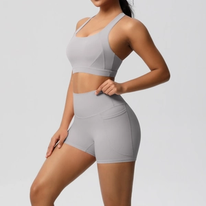 Detail view of high-waist yoga shorts with side pockets and smooth brushed fabric