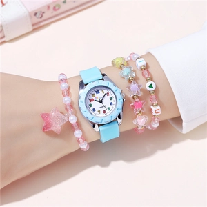 Detail of pink silicone watch and beaded bracelets set with colorful numerals on wrist