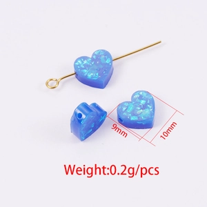 Blue glitter heart-shaped synthetic opal bead with dimensions 9mm x 10mm for jewelry making