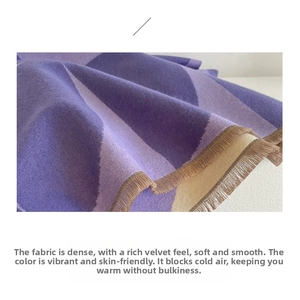 Detail shot of purple striped knit scarf texture and exquisite fringe tassel edges