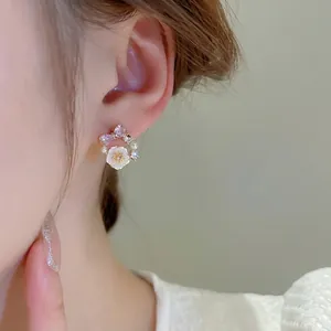 Sparkling flower and pearl stud earrings with purple crystal bow and silver needle posts