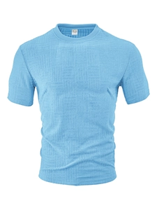 Detail of blue waffle knit polo shirt showing fabric texture and M size collar label