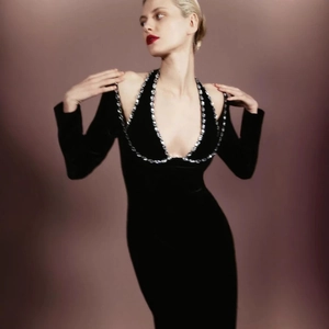 Elegant black velvet evening dress with sparkling silver rhinestone collar and long sleeves