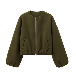 Detail of army green pilot jacket featuring lantern sleeves and silver zipper closure