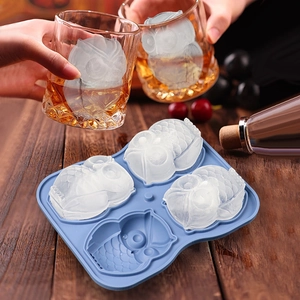 Blue 4-cavity silicone owl ice cube mold with realistic animal-shaped frozen cubes