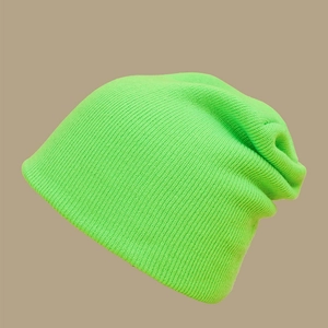 Detailed close-up showing the fine knit texture and neon green fabric of the casual beanie