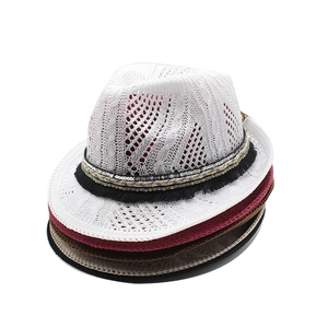 Close-up of hollow knit fedora hats in multiple colors featuring breathable mesh texture