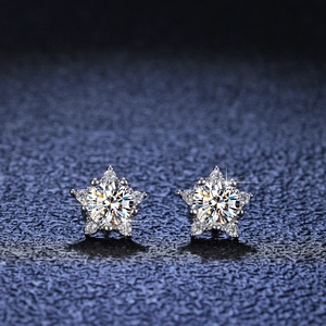 Macro shot of S925 silver star stud earrings with brilliant moissanite center stone