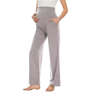 Detail of light grey maternity pants with a high waist elastic support and side pockets