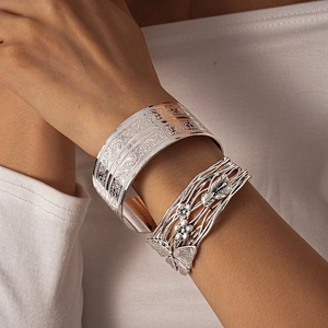 Silver vintage cuff bracelets with embossed floral textures and butterfly filigree design