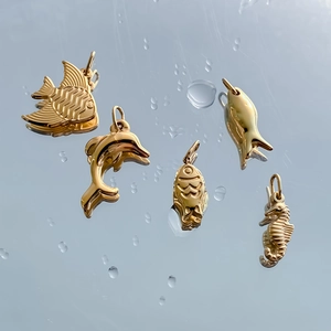 Golden stainless steel sea creature charms including dolphin and seahorse for DIY jewelry