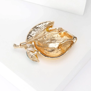 Back view of fresh lemon enamel brooch with detailed gold metal texture and secure pin clasp