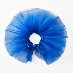 Detail of royal blue tutu skirt featuring layered mesh fabric and a satin bow decoration