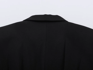 Detailed back view of a black blazer featuring a high-quality collar and structured shoulder design