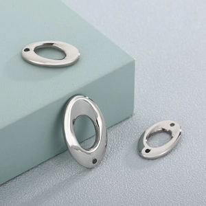 Polished silver oval stainless steel jewelry charms in varied sizes for DIY designs