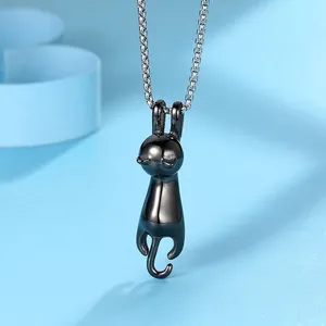 Minimalist black cat pendant necklace in polished titanium steel on light blue background