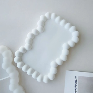 Detailed view of white bubble edge silicone mold for DIY resin coaster casting