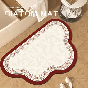 Cloud-shaped superabsorbent diatomite bath mat with red floral pattern and wavy edges