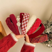 Collection of festive red and cream headbands in tweed and knit textures