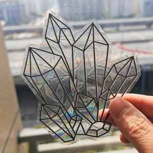 Detailed holographic crystal suncatcher sticker with rainbow effect on window glass