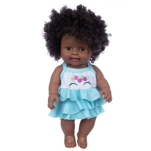 Detail of 12-inch African baby doll with black curly hair in light blue unicorn dress